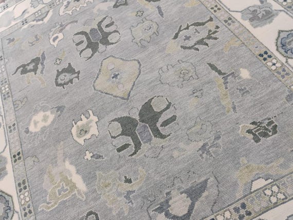 Handmade Grey Wool Oriental Rug: Cream Border, Floral Accents