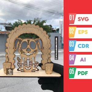 May include: A wooden Day of the Dead dog figurine with a skeleton design, candles, and a decorative arch. The figurine is held in front of a red background with file type icons: SVG, EPS, CDR, AI, and PDF.