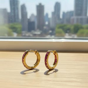 Pink Sapphire Huggie Earrings: 14K Yellow Gold Plated Hoops