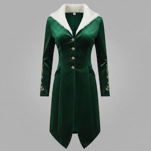 May include: A long, emerald green coat with a white faux fur collar. The coat features gold buttons, pockets, and gold embroidered detailing on the sleeves. The coat has a tailored fit and a unique, asymmetrical hemline.
