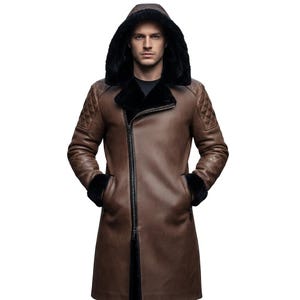 May include: A brown leather coat with a black fur-lined hood and cuffs. The coat has a diagonal zip closure and quilted shoulder detailing. The model is wearing a black shirt under the coat.