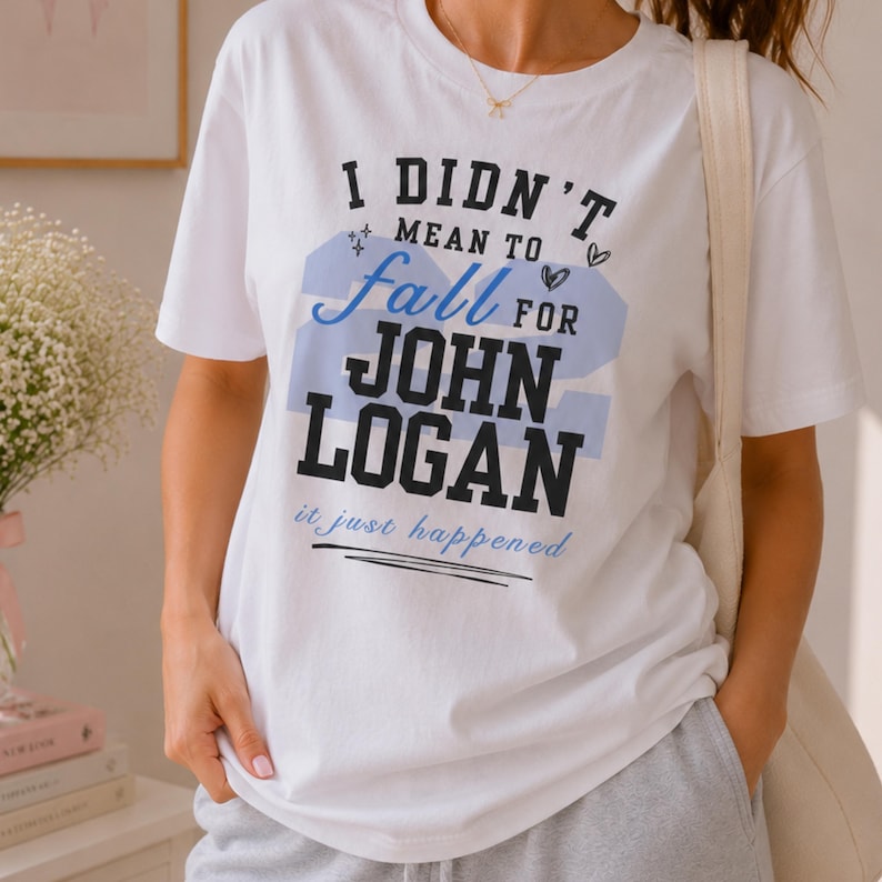 Off Campus shirt white tee John Logan number 22 blue print, model in grey joggers tote bag baby's breath
