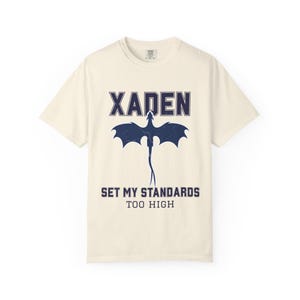 Fourth Wing shirt white Comfort Colors tee navy Xaden dragon graphic, seated model holding pink mug