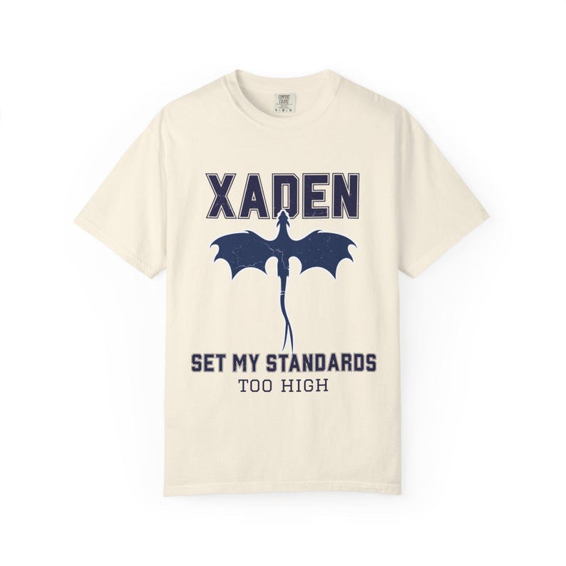 Fourth Wing shirt white Comfort Colors tee navy Xaden dragon graphic, seated model holding pink mug