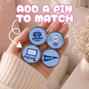 Off Campus Pins held in hand.