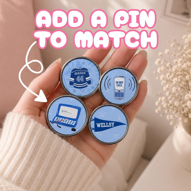 Off Campus Pins held in hand.