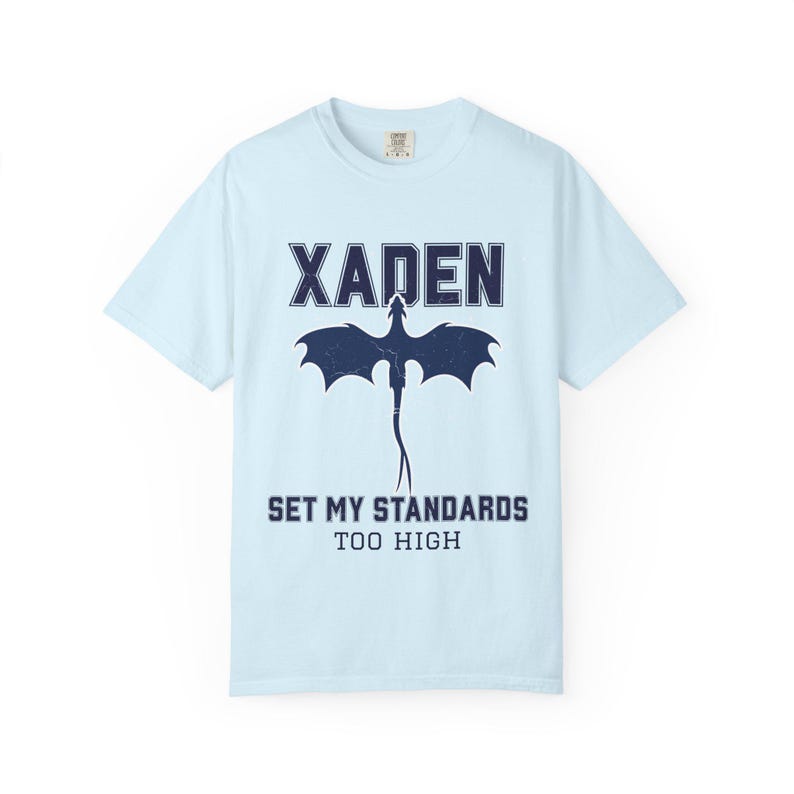 White Fourth Wing dragon tee close-up gray Xaden graphic, model in light blue jeans posing