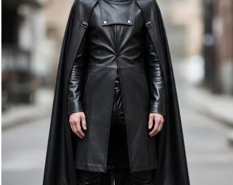 May include: A black leather hooded cape and coat combination. The coat features a button-down front, and the cape is attached at the shoulders with buckles. The outfit is completed with matching black leather pants.