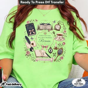 May include: A lime green t-shirt featuring a graphic print of a mansion, a pocket watch, a teacup, a candle, a mirror, a quill, and open books. The text reads: Words may fade, but true promises remain. Honor, loyalty, love. A gentleman's promise.