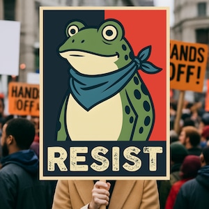 May include: A poster featuring a cartoon frog wearing a blue bandana, set against a red and black background. The word "RESIST" is printed in bold, distressed font. The image is held up in a crowd of people.