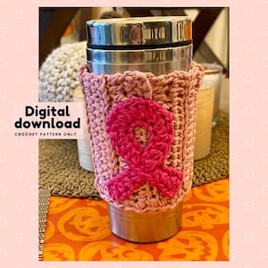 May include: Pink crocheted coffee cup cozy with a pink ribbon design. Digital download crochet pattern only.