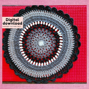 May include: A black, gray, and white crochet doily with a scalloped edge. The doily is on a red background. Digital download crochet pattern only.