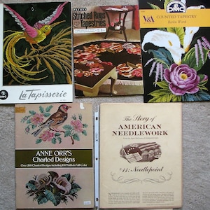 May include: A collection of vintage needlepoint and embroidery books. The books feature a variety of designs, including a bird, flowers, and a rug. The books are titled "La Tapisserie", "Patons Stitched Rugs & Tapestries", "Counted Tapestry Berlin Work", "The Story of American Needlework #11: Needlepoint", and "Anne Orr's Charted Designs".