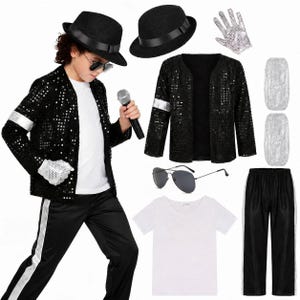 May include: A black sequined jacket with silver sleeve bands, black trousers with silver side stripes, a white v-neck t-shirt, a black fedora, a silver sequined glove, and aviator sunglasses. The set includes a microphone and two silver leg covers.