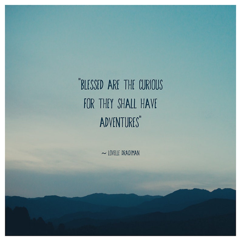 May include: An inspirational image with a gradient blue sky and layered mountain silhouettes. The text reads: "BLESSED ARE THE CURIOUS FOR THEY SHALL HAVE ADVENTURES" by Lovelle Drachman.
