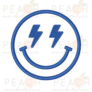 May include: A blue embroidered smiley face design with lightning bolt eyes. The design features a circular outline, a curved smile, and two lightning bolts in place of eyes. The design is on a white background.