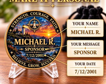 May include: A round commemorative coin on a clear stand featuring a lighthouse at sunset. Text includes STRENGTH, COURAGE, FAITH, BELIEVE, GROW, SUCCEED, MICHAEL R., SPONSOR, and 7/12/2001. The coin is displayed next to labels showing personalization options.