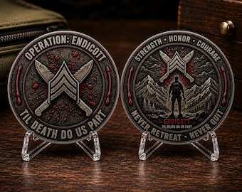 May include: Two circular metal challenge coins displayed on clear plastic stands. The left coin features crossed knives, a chevron, and the text OPERATION: ENDICOTT TIL DEATH DO US PART. The right coin shows a soldier, mountains, and STRENGTH HONOR COURAGE.