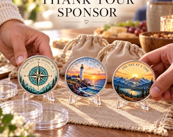 May include: Three circular metal coins on clear stands. The first shows a compass with the text THANK YOU FOR GUIDING ME. The second depicts a lighthouse at sunset with YOU HELPED ME FIND MY WAY. The third shows mountains with ONE DAY AT A TIME.