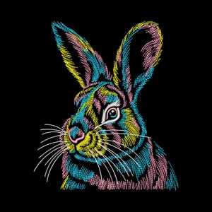 May include: A colorful embroidered rabbit design on a black background. The rabbit features a detailed pattern in shades of blue, yellow, and pink. The rabbit has long ears, a pink nose, and white whiskers. The artwork is a close-up of the rabbit's face.