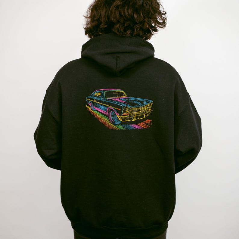 May include: Black hoodie featuring a colorful, stylized illustration of a classic car. The car is depicted with vibrant rainbow-colored outlines and details, set against a black background. The design is on the back of the hoodie.