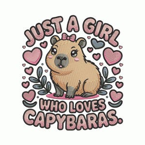 May include: Embroidered design featuring a cartoon capybara with a pink bow, surrounded by hearts and leaves. Text reads "JUST A GIRL WHO LOVES CAPYBARAS" in pink and black. The design is on a white background.