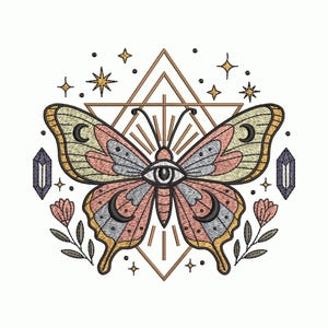 May include: Embroidered butterfly design with an eye in the center, featuring pink, yellow, and gray wings, set against a geometric triangle and surrounded by stars, crystals, and flowers. The design is on a white background.