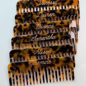May include: Six tortoiseshell-patterned combs, each engraved with a name: Vanessa, Lauren, Bianca, Samantha, Alison, and Jasmine. The combs have fine teeth and a curved top. A personalised hair accessory.
