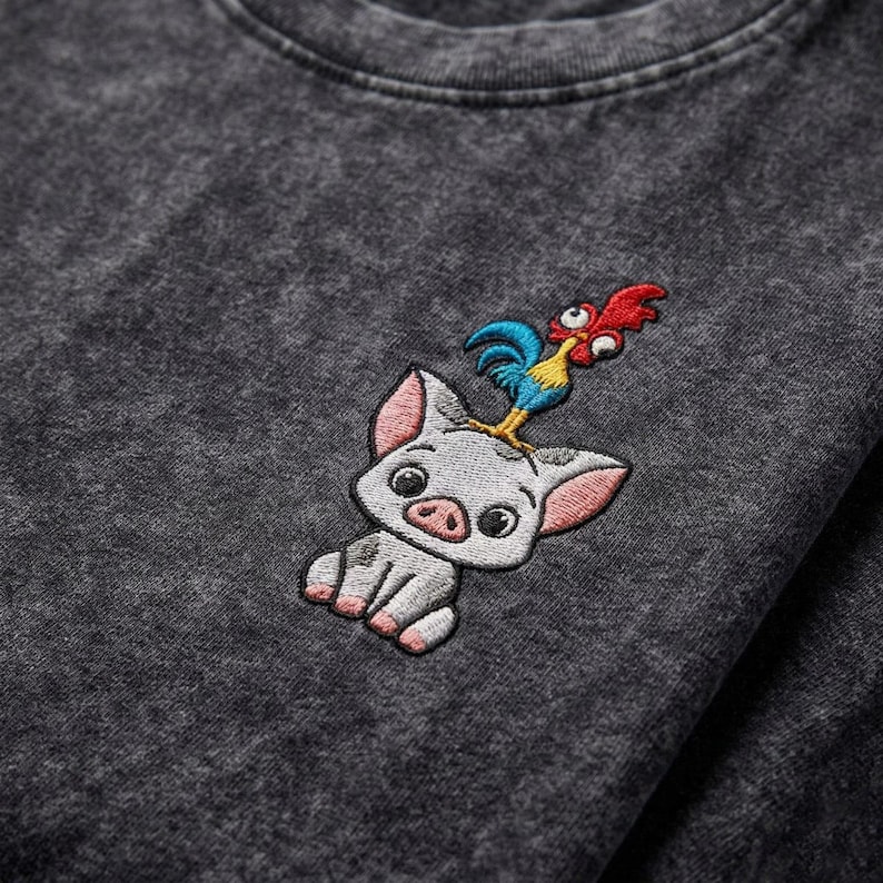 May include: A white ceramic mug with a black handle and the text "But First, Coffee" in a black, handwritten-style font. The mug is on a white surface.