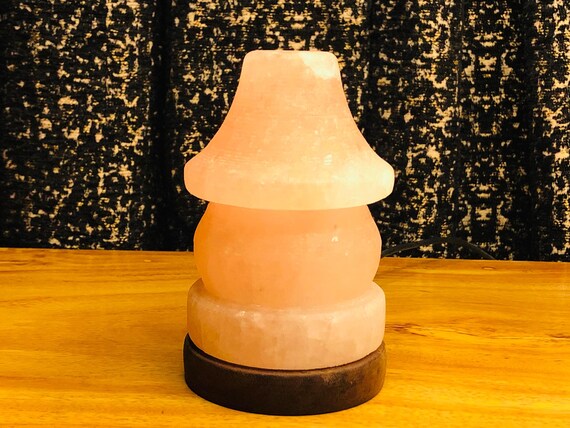 A Solitary Glimmer: The Warm, Gentle Glow of Light in a Serene, Abstract Space, Evoking Calm and Quiet Contemplation .