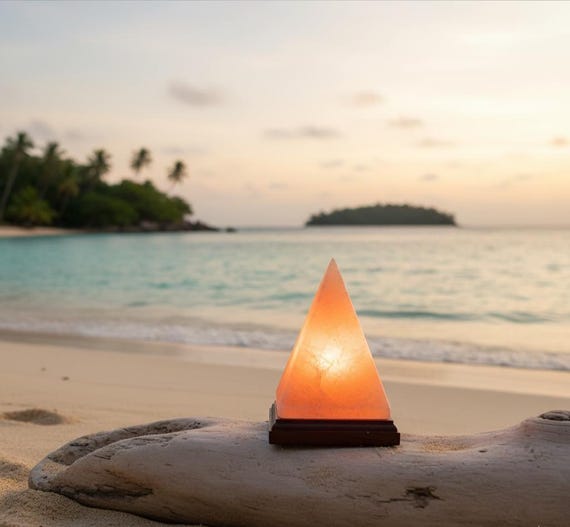 Handcrafted Himalayan Salt Lamp. This unique pyramid-shaped lamp emits a beautiful amber glow .