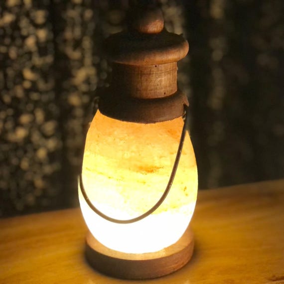 A Solitary Glimmer: The Warm, Gentle Glow of Light in a Serene, Abstract Space, Evoking Calm and Quiet Contemplation .