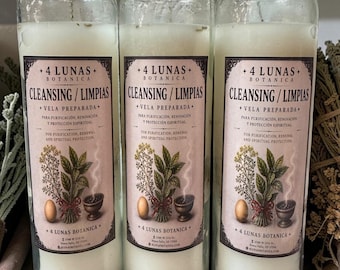May include: Three tall, clear glass pillar candles filled with white wax. Each features a label reading 4 LUNAS BOTANICA, CLEANSING/LIMPIAS, VELA PREPARADA, and FOR PURIFICATION, RENEWAL AND SPIRITUAL PROTECTION, with an illustration of herbs and an egg.