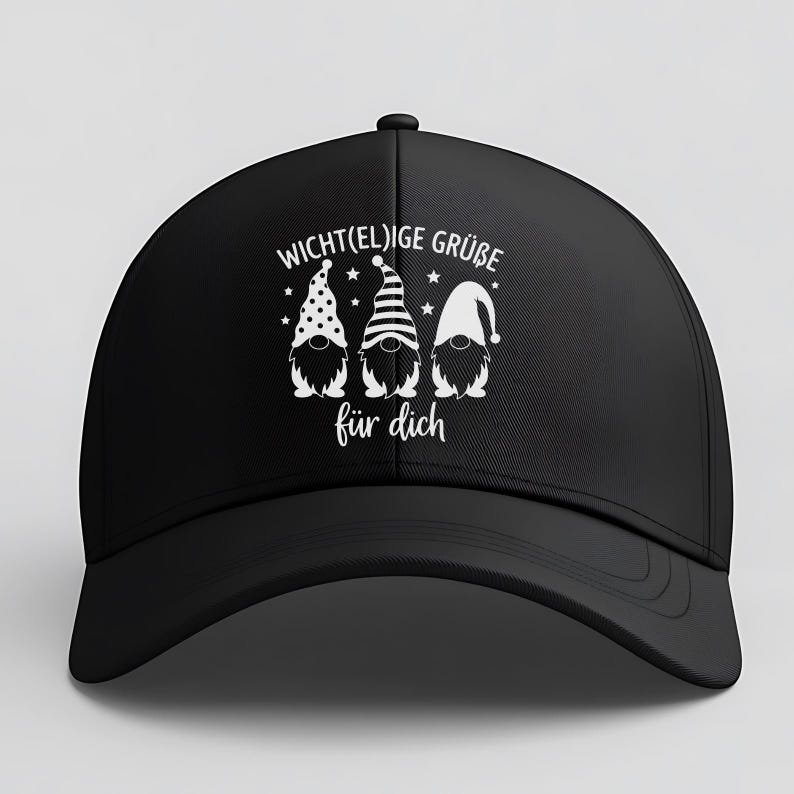 May include: Black baseball cap featuring a white graphic of three gnomes with different hat patterns and the text "Wicht(el)ige Gr&uuml;&szlig;e f&uuml;r dich". The cap has a curved brim and a button on top.