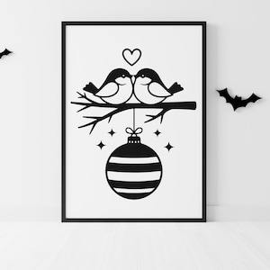 May include: Black and white framed art print featuring two birds perched on a branch, with a heart above them. A striped ornament hangs below, with stars and a bat silhouette. The artwork is a minimalist design.