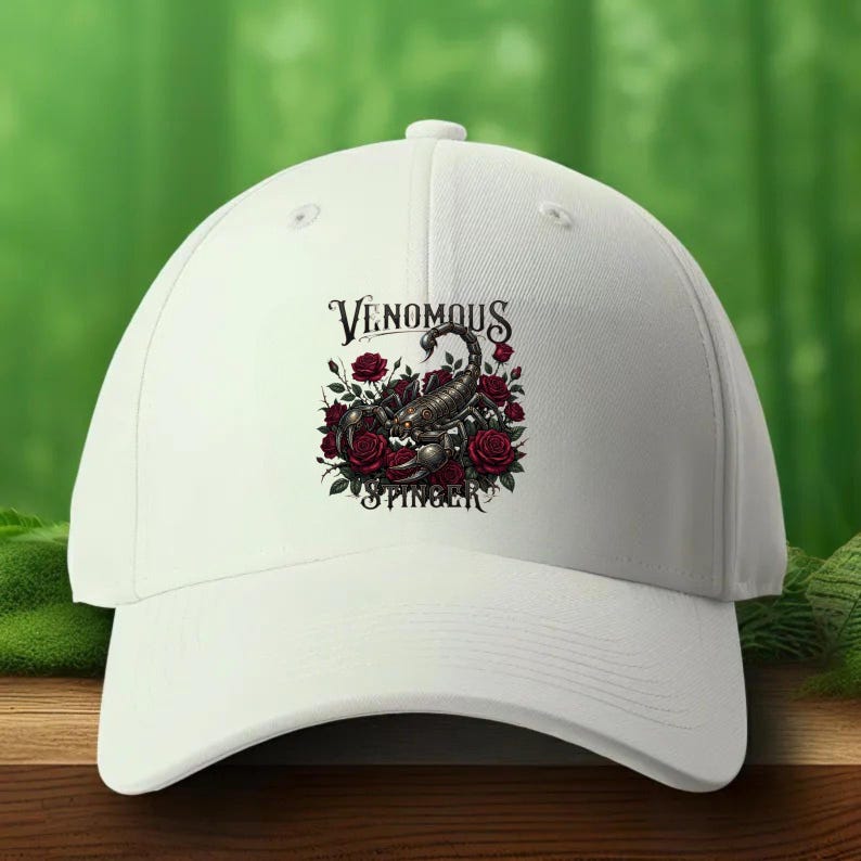 May include: A white baseball cap featuring a central graphic of a dark scorpion surrounded by deep red roses. The text "VENOMOUS STINGER" is printed in a stylized black font above and below the scorpion illustration on the front panel.