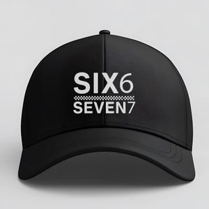 May include: Black baseball cap with the text "SIX6 SEVEN7" in white. The text is above a checkered pattern. The cap has a curved brim and a rounded crown.