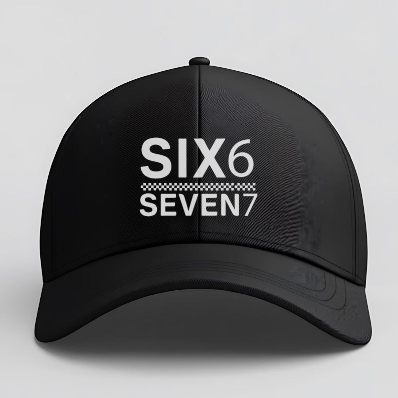 May include: Black baseball cap with the text "SIX6 SEVEN7" in white. The text is above a checkered pattern. The cap has a curved brim and a rounded crown.