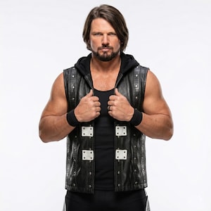 May include: A person wearing a black leather vest with silver rivets and white square accents. The vest is over a black hooded shirt and black undershirt. The person is also wearing black wristbands.