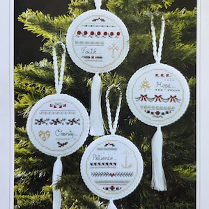 May include: A white ceramic mug with a black handle and the text "But First, Coffee" in a black, bold font. The mug is sitting on a white surface. The mug is approximately 4 inches tall.