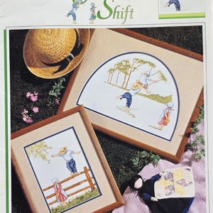 May include: A white ceramic mug with a black handle and the text "But First, Coffee" in a bold, black font. The mug is set against a blurred background, suggesting a cozy setting.