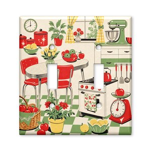 May include: A double light switch cover featuring a retro kitchen illustration with red chairs, a dining table, a green stand mixer, a stove, a red scale, and a checkered floor. The scene includes potted plants, bowls of fruit, and kitchen utensils.