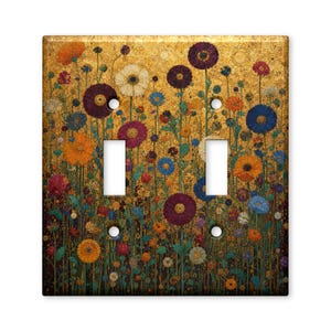 May include: A double light switch wall plate featuring a vibrant floral pattern against a textured gold background. The design includes various flowers in shades of orange, purple, blue, and white, with two rectangular cutouts for switches.