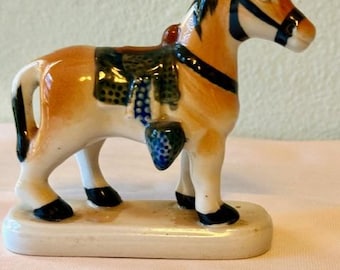 Vintage ceramic horse, hand painted with saddle and bridle. 1950's classic figurine.