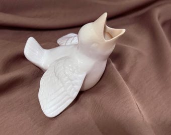 Vintage porcelain baby bird figurine.