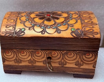 Vintage carved and painted trinket box with key.