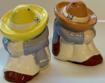 Vintage 1950's Mexican salt and pepper shakers. Ceramic figures with sombreros.