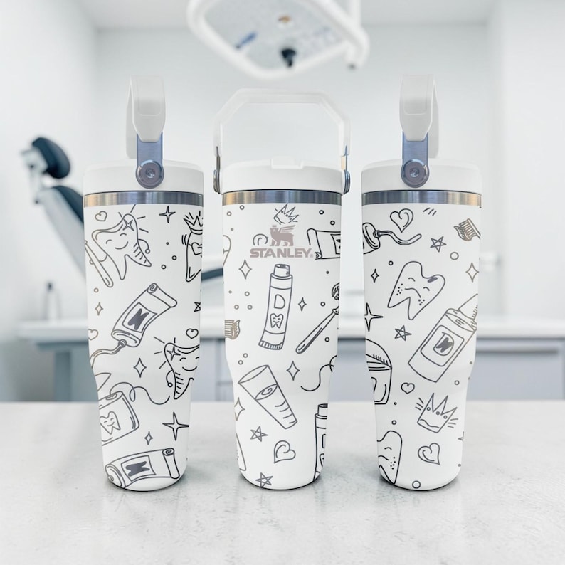 May include: A set of three ceramic mugs with a speckled, matte finish. The mugs are in shades of cream, light gray, and dark gray. Each mug has a simple, minimalist design, perfect for coffee or tea.