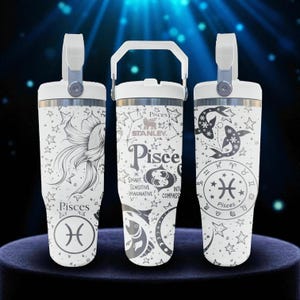 May include: Three white Stanley tumblers with handles, featuring black line art of Pisces zodiac symbols, fish illustrations, stars, and constellations. The text includes "Pisces," "Smart," "Sensitive," "Imaginative," and "Compassionate."