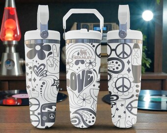 May include: Three white Stanley tumblers with a repeating black graphic pattern featuring peace signs, flowers, hearts, boots, and the word LOVE. Each tumbler has a white lid with a handle and a metallic rim. The design includes retro-inspired icons.
